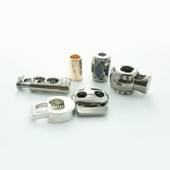 Metal rope and cord stoppers